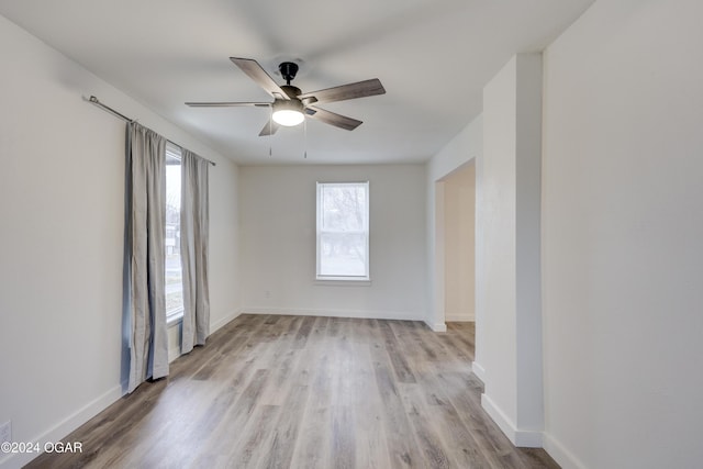 unfurnished room featuring light hardwood / wood-style flooring and ceiling fan