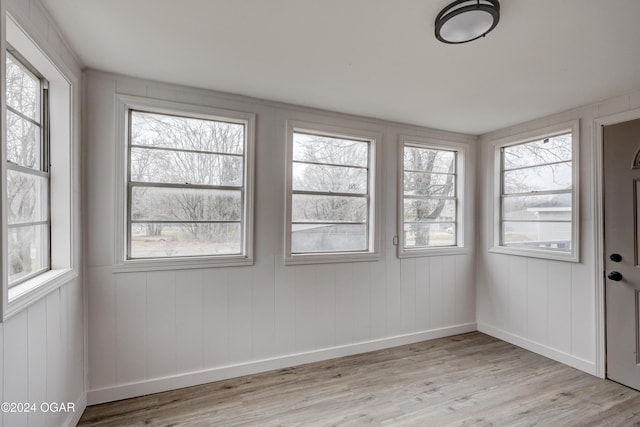 unfurnished sunroom with a wealth of natural light