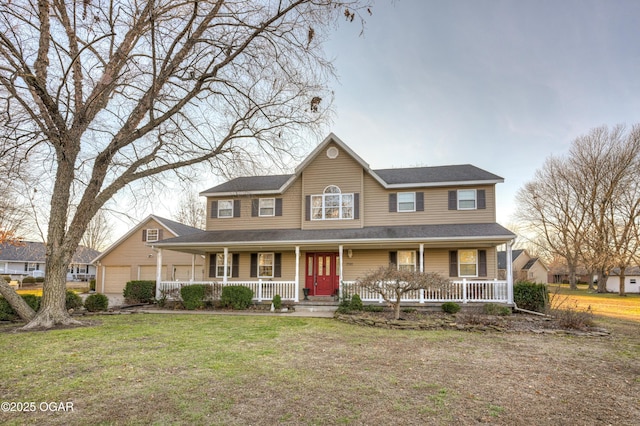 view of front of house with a front lawn, an outdoor structure, and a garage