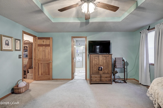 bedroom featuring carpet flooring, ceiling fan, and ensuite bathroom