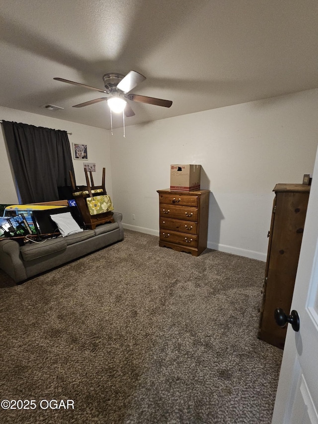 bedroom with ceiling fan, a textured ceiling, and dark colored carpet