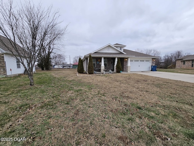 view of front of property featuring a porch, a garage, and a front lawn