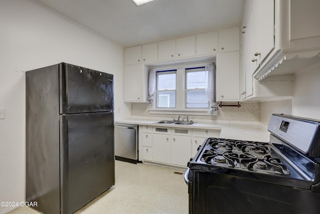 kitchen with tasteful backsplash, white cabinetry, sink, and black appliances