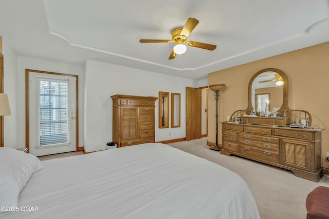 carpeted bedroom with access to outside and ceiling fan