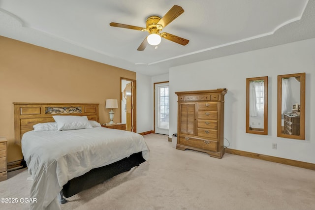 bedroom featuring ceiling fan and light carpet