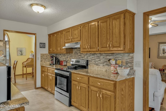 kitchen with light stone countertops, decorative backsplash, a textured ceiling, stainless steel electric stove, and ceiling fan