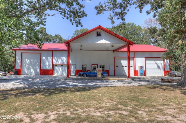 exterior space with a yard and a garage