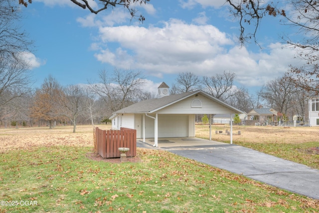 view of front of property with a front yard and a carport