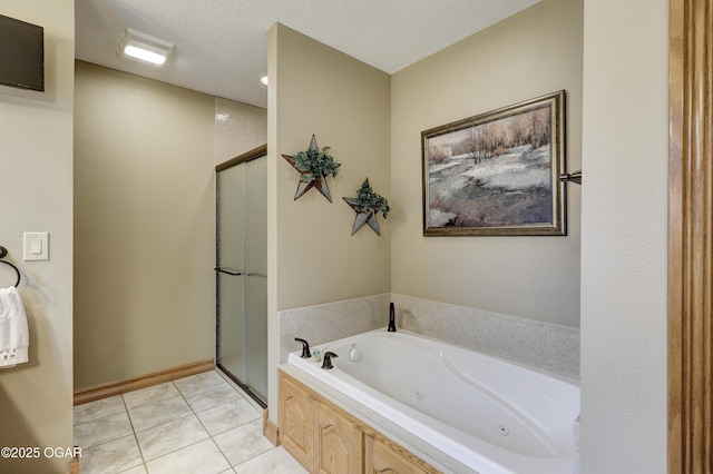 bathroom with separate shower and tub, tile patterned flooring, and a textured ceiling