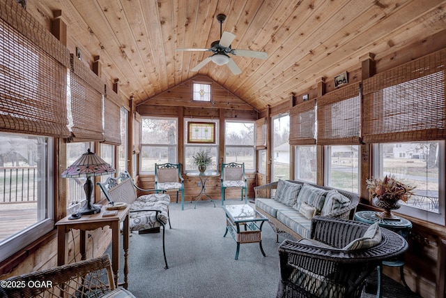 sunroom featuring plenty of natural light, ceiling fan, wooden ceiling, and vaulted ceiling