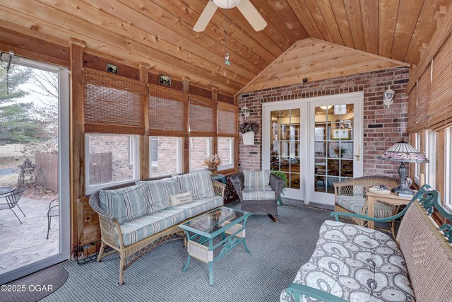 sunroom / solarium featuring vaulted ceiling, ceiling fan, and wooden ceiling