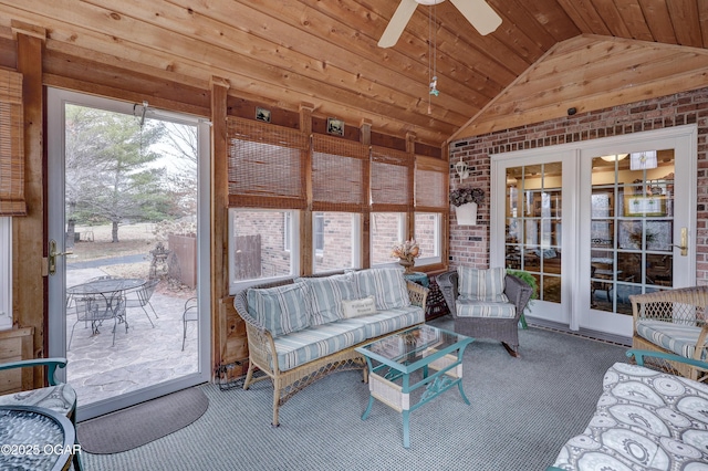 sunroom with ceiling fan, wooden ceiling, and lofted ceiling