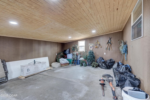 misc room featuring concrete flooring and wooden ceiling