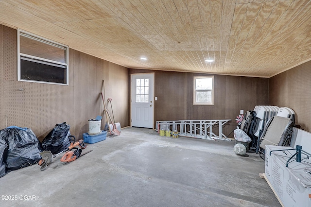 interior space with wood walls and wooden ceiling