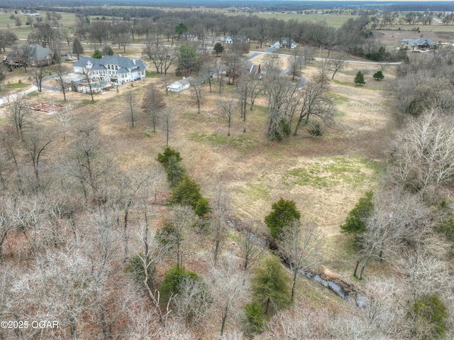 birds eye view of property featuring a rural view