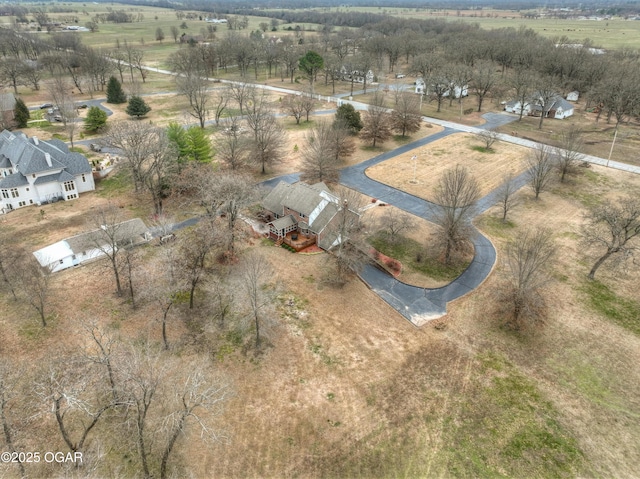 birds eye view of property featuring a rural view