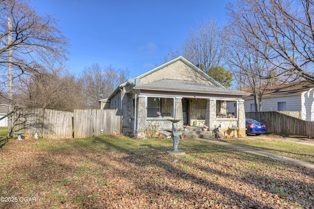 bungalow featuring a front yard