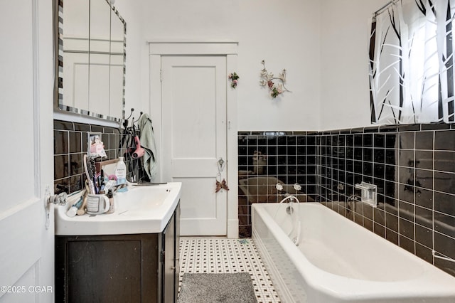 bathroom featuring a bath and vanity