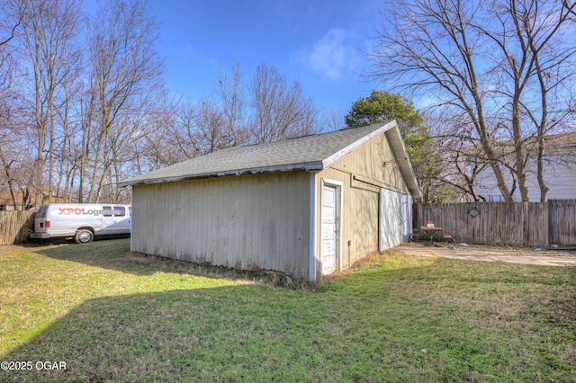 view of outbuilding with a lawn