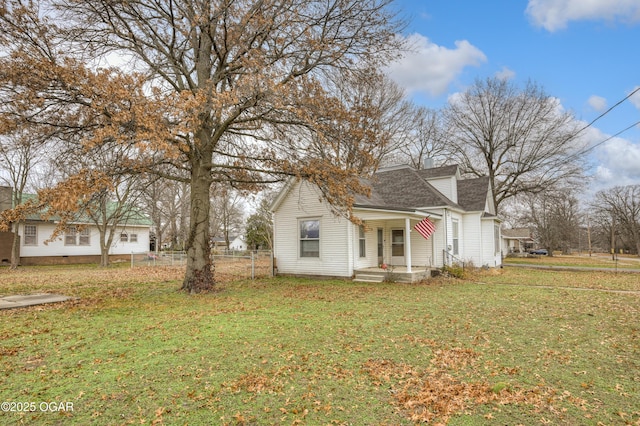 view of side of property featuring a yard