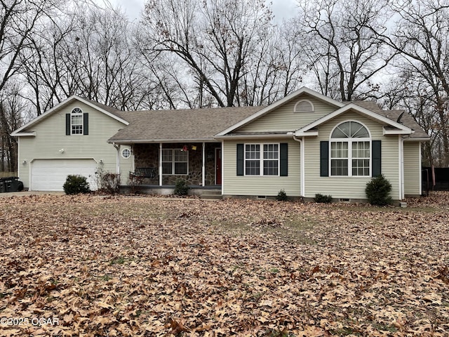 view of front of home featuring covered porch and a garage