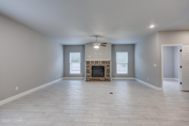 unfurnished living room with ceiling fan