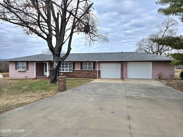 single story home featuring a front yard and a garage