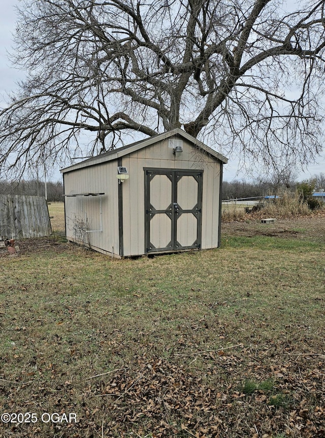 view of outbuilding with a lawn