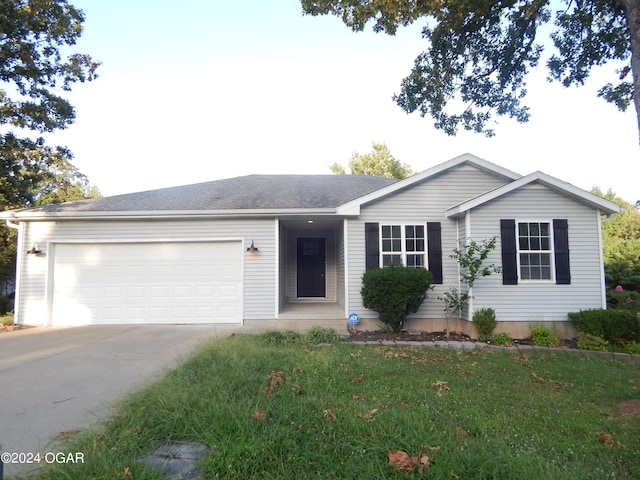 ranch-style house featuring a garage