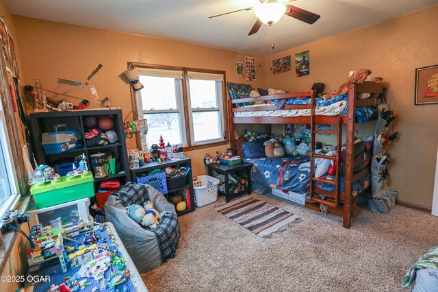 202 Arbor Dr, Lamar, MO 64759 - carpeted bedroom featuring ceiling fan