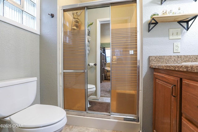 202 Arbor Dr, Lamar, MO 64759 - bathroom with vanity, toilet, and a shower with door