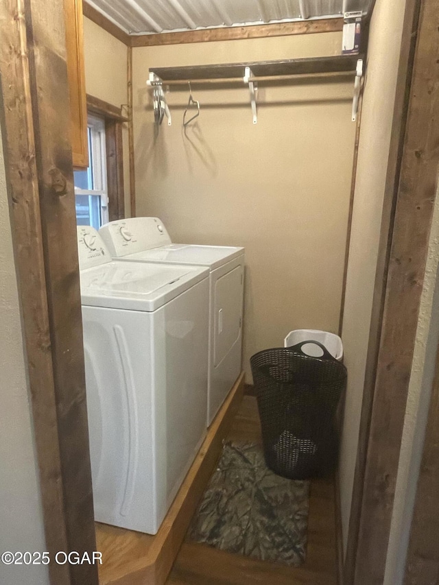 clothes washing area with washer and dryer