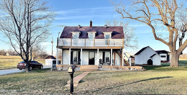 view of front of house with a porch and a front lawn