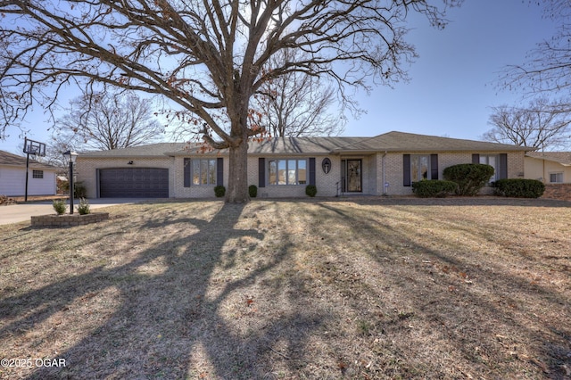 single story home with a garage and a front yard