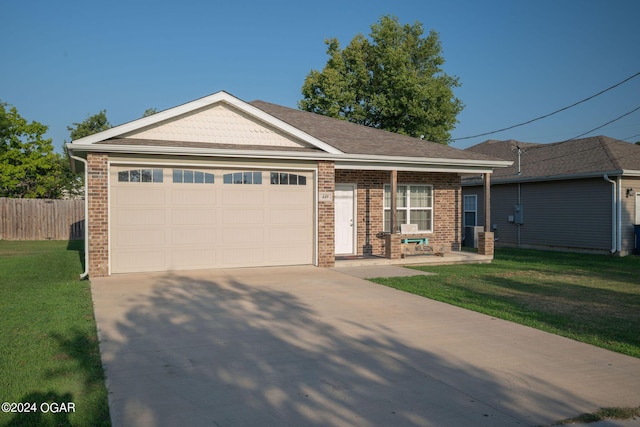 single story home featuring a front yard and a garage