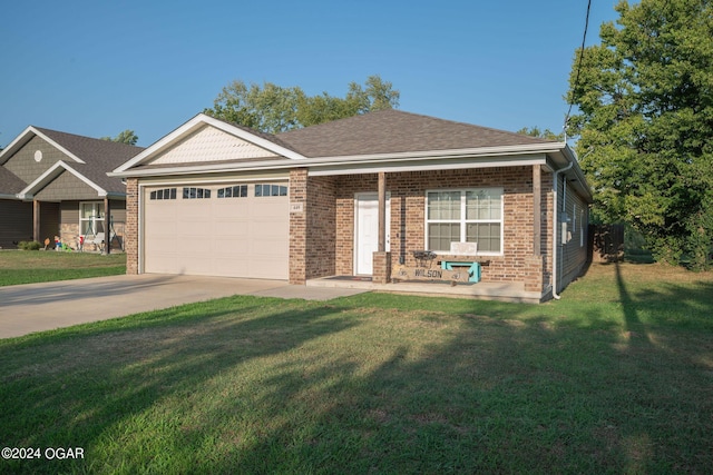 view of front of property featuring a front yard and a garage