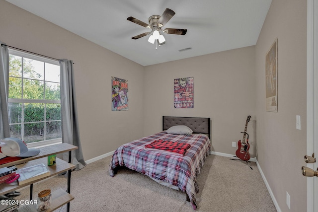 bedroom featuring ceiling fan and light colored carpet