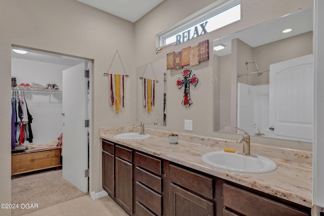 bathroom with tile patterned floors and vanity