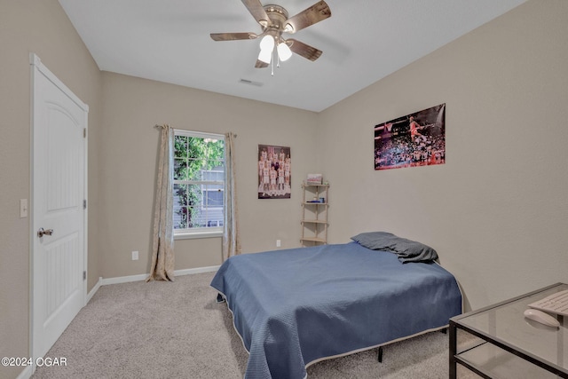 bedroom with ceiling fan and carpet floors