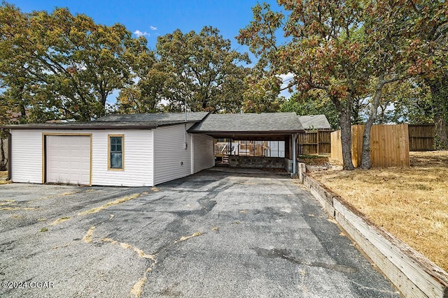 exterior space featuring a garage and a carport