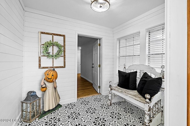 hallway with wood walls