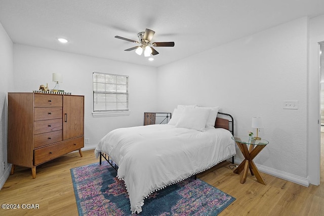 bedroom featuring ceiling fan and wood-type flooring