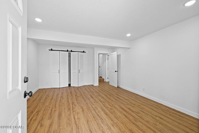 unfurnished bedroom with light wood-type flooring