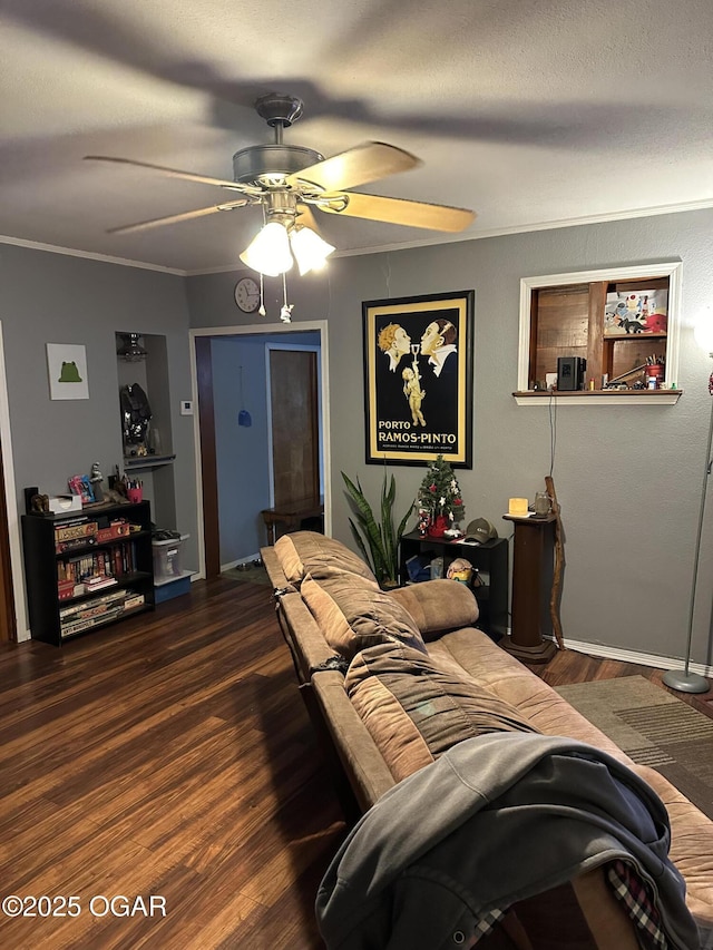 living room featuring hardwood / wood-style floors, ceiling fan, and ornamental molding