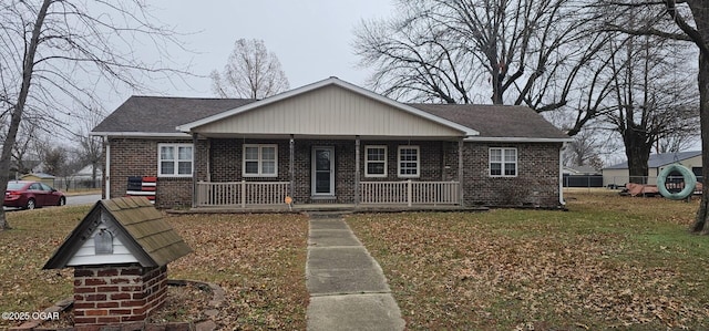 view of front of home with a front yard and a porch