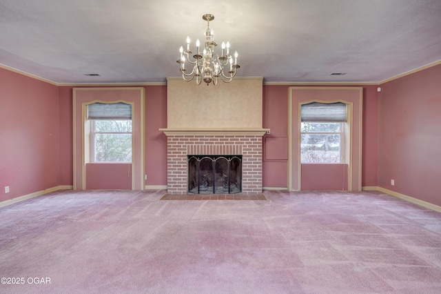 unfurnished living room with a fireplace, carpet floors, an inviting chandelier, and ornamental molding