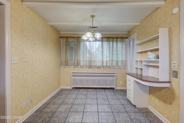 unfurnished dining area featuring radiator heating unit, tile patterned floors, a notable chandelier, and beam ceiling