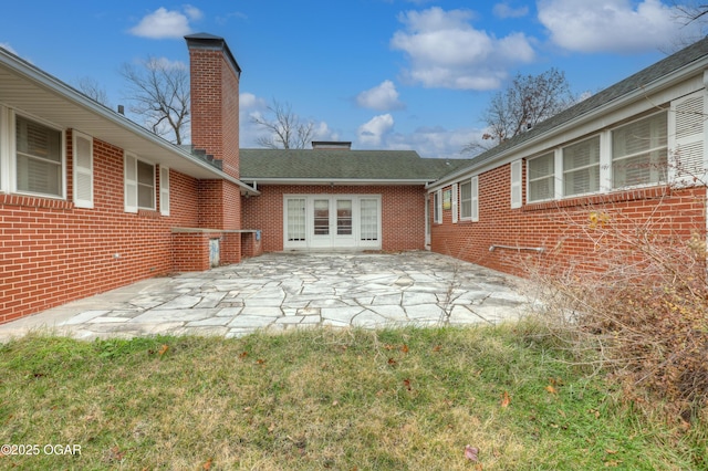 rear view of property featuring a patio area