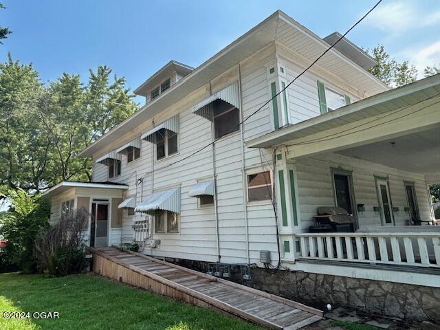 view of home's exterior with a lawn