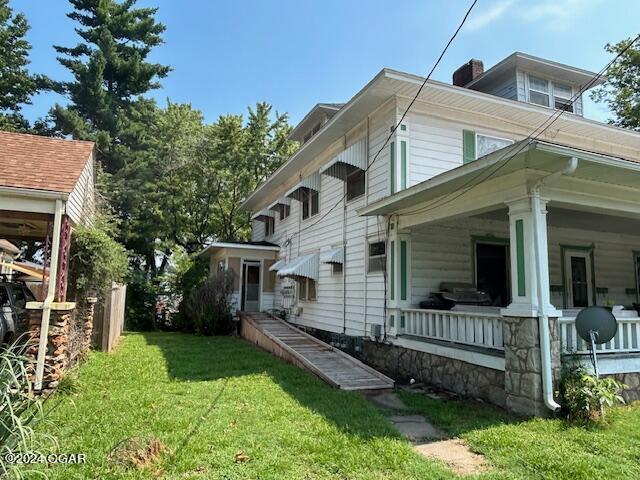 view of home's exterior with a lawn